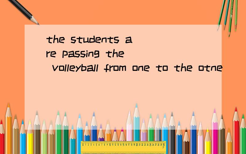 the students are passing the volleyball from one to the otne